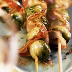 the skewers are covered with vegetables and sauce