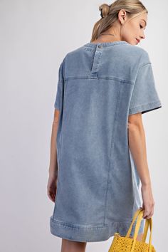 Details Brand: Easel Denim Tunic Dress Mineral Wash Panel Detailing Rounded Neckline Slightly Dropped Shoulders Short Sleeves Front Pockets Snap Back Button Closure Material and Care 97% Cotton 3% Spandex Hand Wash Cold Hang or Line Dry Measurements of Garment Bust of the garment is measured armpit to armpit and then doubled. Length of the garment is measured from the top of the shoulder to the bottom of the hem line. Sleeve Length of the garment is measured from the top part of the shoulder sea Washed Blue Chambray Denim Dress, Casual Washed Chambray Denim Dress, Casual Washed Blue Chambray Denim Dress, Cotton Denim Dress With Frayed Hem And Short Sleeves, Casual Washed Blue Cotton Denim Dress, Relaxed Fit Washed Denim Dress, Medium Wash Chambray Denim Dress, Washed Blue Cotton Denim Dress With Button Closure, Relaxed Fit Denim Dress With Frayed Hem