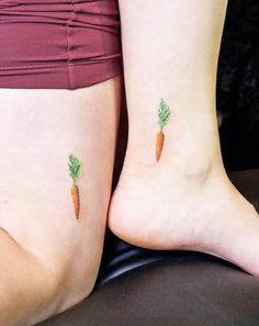 two women with carrot tattoos on their legs