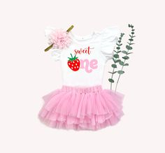 ♥ Sweet One 1st Birthday Tutu outfit ♥ This sweet pink tutu outfit is sure to be a special addition to your little one's first birthday. Bodysuit has 3 snap closure and expandable shoulders, 100% cotton. Flutter sleeve bodysuits are 90% cotton, 10% spandex and are sized smaller than a standard Onesie® as they are meant to fit snug to the body like a ballet leotard. ORDER TRACKING All orders shipped to the US include tracking. The free shipping option for this item within Canada does not offer tr Pink Birthday Set For Spring, Sweet Pink Sets For Birthday, Sweet Pink Birthday Sets, Pink Spring Birthday Set, Sweet Pink Birthday Set, Pink Ruffled Birthday Set, Cute Pink Tutu Dress For Birthday, Sweet White Tutu Dress For First Birthday, Pink Princess Sets For Birthday