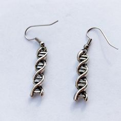 DNA pendant earrings minimalist style gift for her. A minimalist style of this earrings allows to put them with any look on any occasions : Party, Christmas, Birthday, Mother day, Graduation. This cabochon earrings are unique gift for women. You can find more products in my shop : https://www.etsy.com/shop/LorredJewelry?ref=seller-platform-mcnav .The product is sent after 1 - 2 buisiness days.Shipping times :1 week in France.1-2 weeks in Europe.2 weeks in USA and Canada.2 - 3 weeks for the rest Trendy Earrings For Mother's Day Gift, Trendy Metal Jewelry For Birthdays, Nickel Free Earrings For Mother's Day Gift, Nickel-free Earrings For Mother's Day Gift, Nickel-free Earrings Gift For Mother's Day, Minimalist Earrings For Mother's Day Gift, Hypoallergenic Metal Jewelry For Gifts, Trendy Drop Earrings For Gifts, Minimalist Silver Earrings For Mother's Day