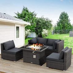 a fire pit sitting on top of a wooden deck