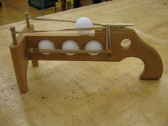 an object made out of wood with eggs in it