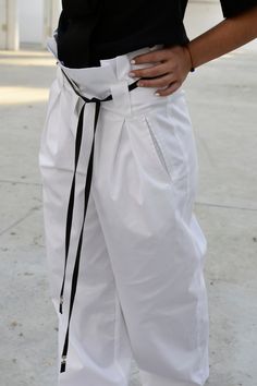 "Pants For Women, White Pants, Japanese Clothing This one is a very trendy high-wasted pants. It is shaped precisely for extravagant appearance. The belt is not part of the pants. It has been used to style them. If you wish to add the belt, please select the option pants + belt. You can style it with the top - https://etsy.me/2TeHIf3 ◈ Stylish and chic fashion is our shared dream! You can be sure that this piece is made with a lot of love and craftsmanship. ◈ S I Z I N G ◈ This item is available White Baggy High Waist Harem Pants, White High Waist Baggy Harem Pants, White Straight Parachute Pants For Work, Chic White Baggy Wide Leg Pants, Baggy White Wide Leg Pants For Work, White Baggy Wide Leg Pants For Work, White Baggy Wide-leg Harem Pants, Wide-leg Cotton Harem Pants With Belt Loops, High-waisted Parachute Pants With Belt Loops For Summer