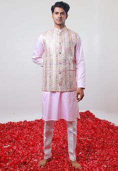 Art Silk Kurta in Baby Pink. This Readymade Chinese Collar Neck and Full Sleeve attire is Enhanced with Fancy Buttons, Mirror Effect, Resham and Sequins Work Available with a Cotton Silk Aligarhi Pant in White and a Faux Georgette Nehru Jacket in Baby Pink Do note: Footwear shown in the image is for presentation purposes only. Half to one inch may vary in measurement. (Slight variation in actual color vs. image is possible) We sell all kinds of menswear. Mens Kurta | Mens Kurta Pajama | Mens She Spring Festive Kurta With Motifs, Traditional Pink Bandhgala With Resham Embroidery, Pink Bandhgala With Chikankari Embroidery For Festive Occasions, Pink Bandhgala With Resham Embroidery For Festive Occasions, Traditional Pink Kurta With Handwork, Traditional Pink Bandhgala With Chikankari Embroidery, Pink Resham Embroidered Bandhgala For Festivals, Pink Bandhgala With Resham Embroidery For Festivals, Pink Bandhgala For Eid Festivities