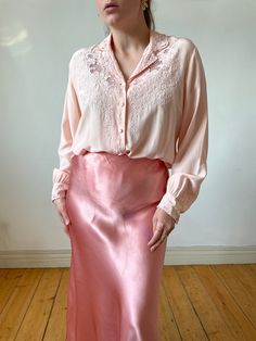 Beautiful pink vintage silk hand embroidered long sleeve blouse.  Made out of very pleasant silk fabric. Truly elegant and a very rare find.  -100% pure silk -tag size:  40 -label: peony, made in shanghai Circa: 50s Best fits: S - M Condition: overall superb, no marks under armpits, very light marks at the back, on the sleeve but barely noticeable  MEASUREMENTS *taken seam to seam. not doubled, taken flat Shoulders: 45 cm | 17.7" Bust: 52 cm | 20.4" Sleeve length: 57 cm | 22.4" Length: 56 cm | 2 Feminine Long Sleeve Embroidered Blouse, Elegant Embroidered Pink Blouse, Elegant Pink Embroidered Blouse, Silk Long Sleeve Tops With Floral Embroidery, Pink Embroidered Feminine Blouse, Pink Feminine Embroidered Blouse, Silk Tops With Floral Embroidery And Long Sleeves, Feminine Blouse With Floral Embroidery For Wedding, Pink Floral Embroidered Blouse For Daywear