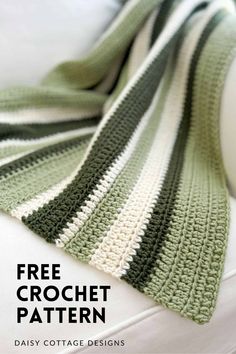 a green and white crocheted blanket with text overlay that reads, free crochet pattern daisy cottage designs