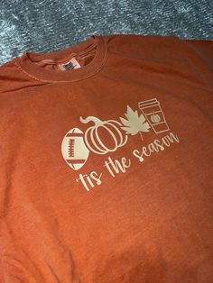 Fall Tshirt available on Comfort Colors Shirts. 100% cotton, great quality tshirts. perfect for all of Fall. Wear to a football party, work, or for every day casual wear. Available in tshirt color Yam, Brick, or Expresso. The Vinyl color is a pretty off-white, tan color that's perfect for the Fall season. Orange Short Sleeve T-shirt For Game Day, Casual Crew Neck T-shirt For Football Season, Orange Cotton T-shirt For Game Day, Team-colored T-shirt For Game Day In Fall, College Team Spirit T-shirt For Fall, Sporty T-shirt For Fall Sports Events, Collegiate Fall T-shirt With Team Name, Football Season School Spirit Crew Neck T-shirt, School Spirit T-shirt For Football Season