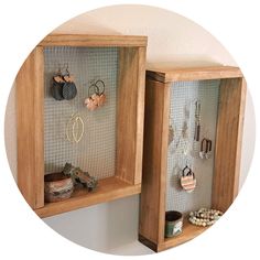 there are two wooden cabinets with earrings on them