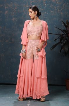 Shop gorgeous peach embroidered three piece palazzo suit online in USA with cape. Flaunt Indian style at parties and weddings in beautiful designer dresses, salwar suits, Anarkali suits, gowns, palazzo suits from Pure Elegance Indian fashion store in USA.-full view Peach Palazzo Set With Resham Embroidery, Elegant Peach Palazzo Set For Festive Occasions, Pink Sets With Dupatta And Cape Sleeves, Pink Cape Sleeves Set With Dupatta, Pink Dupatta Set With Cape Sleeves, Peach Sharara With Sheer Dupatta, Pink Sharara With Dupatta And Cape Sleeves, Elegant Party Pant Set With Cape Sleeves, Pink Party Sets With Cape Sleeves