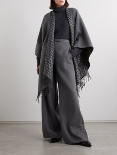 Valentino Garavani's poncho is a chic way to stay warm in transitional weather. Made from sumptuous wool, silk and cashmere-blend, it's jacquard-knitted with the 'VLOGO' at the reverse and has an enveloping design traced with swishy fringing. The deep charcoal shade is endlessly versatile. Cashmere Poncho, Fringed Poncho, Dress Flats, Exclusive Dress, Sport Swimwear, Sports Skirts, Shearling Jacket, The Deep, Skirt Top