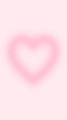 a heart shaped object on a pink background