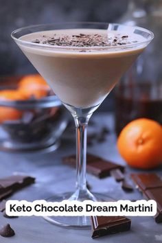 a martini glass filled with chocolate and cream