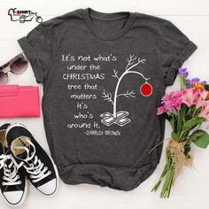 a t - shirt with the quote it's not what's under the christmas tree that matters its who's around it