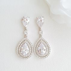 Buy These pear-shaped cubic zirconia drop earrings are sparkly and perfect for brides and weddings. In the silver finish, these sparkly earrings are made with clear cubic zirconia with layered teardrop crystals. Combined with rhodium plating the pear-shaped earrings add a trendy but traditional bridal look. Shop Now! Traditional Bridal Look, Crystal Making, Rose Gold Earrings Wedding, Gold Teardrop Earrings, Earrings For Wedding, Formal Earrings, Dangle Earrings Wedding, Formal Jewelry, Gold Earrings Wedding