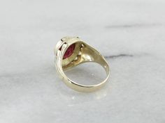 A classic 1930's retro era setting, lightly etched with linear and geometric designs - outfitted with a synthetic ruby stone, reverse-carved with the Shriner's symbol, this men's ring is one handsome piece! The Ancient Arabic Order of the Nobles of the Mystic Shrine, also commonly known as Shriners, is a men's fraternity organization associated with the Free Masons. The Shriner's symbol is inlaid into the ruby red stone with stunning saturated yellow gold! Metal: 14K Yellow Gold Gem: Red Glass G Yellow Gold Sapphire Ring, Retro Era, Cameo Ring, Ruby Stone, Glass Gems, Oval Rings, Red Stone, Red Glass, Geometric Designs