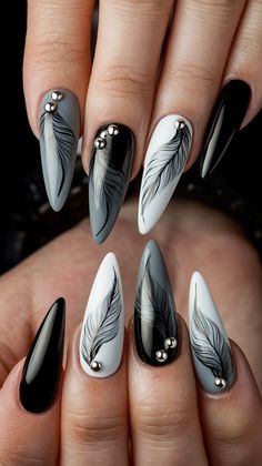 Discover the chic allure of this stunning nail design featuring long, stiletto-shaped nails adorned with beautifully hand-painted feather patterns. The combination of glossy black and white, alongside a soft gray base, creates a striking contrast. Accented with delicate metallic embellishments, these nails are perfect for making a bold fashion statement!
#nailsdesign #nailsinspo #decembernails #winternails #acrylicnails Stiletto Shaped Nails, Feather Pattern, The Chic, Nail Designs, Hand Painted