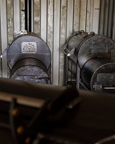 two large metal tanks sitting next to each other