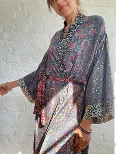 "This is super stylish kimono robe made free size with wrap tie closing  easy fit all ladies, feels very comfortable and light  Can be used as an everyday robe or boho street style over all with jeans and t shirt  It is made one of a kind, patchwork from varieties of different floral silky materials  MEAESURE shoulder 17\" length 55\" MATERIAL *poliester, no lining more available at  https://www.etsy.com/shop/AltheaStores? CARE INSTRUCTIONS  * Wash in warm water * Hand wash recommended * Hang to Silk Wrap Kimono For Loungewear, Bohemian V-neck Robe For Loungewear, Bohemian Wrap Robe For Festivals, Hippie Wrap Kimono One Size, Bohemian Free Size Kimono For Loungewear, Bohemian Silk Wrap Kimono, Bohemian Open Front Robe For Loungewear, Bohemian Open Front Loungewear Robe, Long Kimono For Loungewear