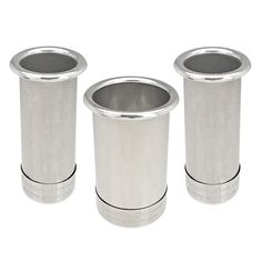 three stainless steel cups sitting next to each other