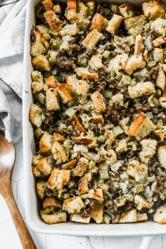 a casserole dish filled with stuffing and bread