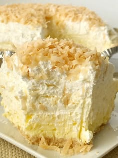 a close up of a piece of cake on a plate with a fork in it