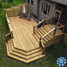 a large wooden deck with steps and railings