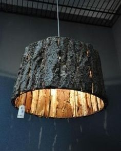 a wooden light hanging from the ceiling