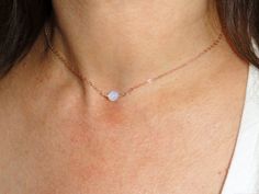 "Elegant delicate rose gold moonstone choker necklace. Moonstone choker necklace, Rose gold filled necklace This listing is for a rose gold filled necklace with a 6mm faceted moonstone bead at its centre. The measurements for the necklace are approx 38cm or 15\". The necklace is finished off with a rose gold clasp. Please contact me if you have any questions. About Moonstone Moonstone's magical play of light brings a romantic, sensuous and seductive feeling. Moonstone is translucent, and softens Dainty Rose Gold Moonstone Jewelry, Dainty Adjustable Moonstone Necklace, Dainty Moonstone Clavicle Chain Necklace, Moonstone Choker Jewelry Gift, Dainty Rose Gold Crystal Necklace, Moonstone Choker Necklace For Gift, Minimalist Rose Gold Choker Jewelry, Adjustable Rose Gold Moonstone Jewelry, Dainty Rose Gold Choker With Delicate Chain