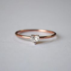 "Colorless Moissanite Diamond Engagement Ring 14K Rose Gold Prong Accent Wedding Ring Hear Cut Diamond Anniversary Gift Ring For Women  ✎ One note for our all lovely customers, the stone you saw in listed jewelry on our store which is only handmade and ordinary. which has been made by our skilled and professional tradesperson which is worthy ❖ Moissanite Details: ⇨ Shape: Heart ⇨ Color: Colorless ⇨ Clarity: VVS ⇨ Weight: 0.13 CT ⇨ Stone Dimension: 3.5 mm. ✎ Photos of particular listed jewelry wh Heart-shaped Rose Gold Solitaire Jewelry, Dainty Heart Cut White Gold Diamond Ring, Rose Gold Promise Ring With Single Diamond, Heart Shaped Rose Gold Solitaire Jewelry, Dainty Rose Gold Heart Ring With Cubic Zirconia, Rose Gold Solitaire Ring For Valentine's Day, Promise Ring In Rose Gold With Single Diamond, Rose Gold Ring With Single Diamond And Cubic Zirconia, Classic Heart Diamond Ring In Rose Gold