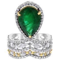 With a crown jewel structure and a mix of colors and shapes, the Danya ring is unique, sweet and attractive. Gemstones Type: Emerald Gemstones Shape: Pear Shape Gemstones Weight: 5.04 ct Gemstones Color: Green Diamonds Shape: Round & Marquise Side Diamonds Weight: 1.79 ct Side Diamond Color: G Side Diamond Clarity: VS (Very Slightly Included) Metal: 18K Gold Metal Wt: 6.77 gms Setting: Prong set Finger Size: 7 To have the ring sized, please note the desired size in Special Instructions during ch Green Diamonds, Mix Of Colors, Emerald Diamond Ring, Diamond Free, Wedding Ring Designs, Green Diamond, Diamonds And Gold, Diamond Solitaire Engagement Ring, Emerald Gemstone