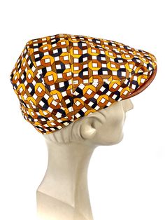 Funny cap in printed fabric with geometric motifs inspired by funk disco era from the 70s, in light and breathable fabric. The upper of the visor cap is made of chocolate brown natural leather. This detail contrast the front profile of the cap with the printed fabric in brown tones: beige, honey, orange, hazelnut and chocolate brown. Cut and sewn on the bias, this cap adapts very well to the head due to its original pattern. The interior is made of a very light cotton lining For its production w Retro Brown Hats One Size Fits Most, Retro Brown Hat, One Size Fits Most, Retro Brown Hats, One Size Fits Most, Retro Brown Hat With Curved Brim, Retro Brown Hat, Retro Brown Adjustable Hat, Fitted Brown Flat Cap, Brown Fitted Flat Cap, Disco Funk