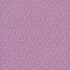 a purple fabric with small white flowers on it