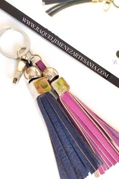 a key chain with several tassels attached to it