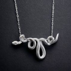 Snake Necklace, We presented this Necklace with the option of silver or white bronze. The pendant is completely handmade and will be produced in the same image even if you buy the material of silver or white bronze. -Item Details - Gender : Male / Female - Materials: 925K Sterling Silver/ white bronze - Dimensions : 60 mm * 27 mm / 2.4 inc * 1 inc * Ready to Ship in 1-3 Business Days * The product is sent with a suitable box for gifting. *visit our store for unique unique jewelry and the most ad Handmade Silver Snake Chain Jewelry, Handmade Symbolic White Gold Necklace, Unique Silver Snake Chain Jewelry, Unique Handmade Snake Chain Jewelry, Unique Hand Cast Silver Necklace, Handmade Sterling Silver Snake Chain Jewelry, Artistic Hand Cast Silver Necklace, Metal Snake-shape Chain Necklace As A Gift, Symbolic Silver Snake-shaped Jewelry