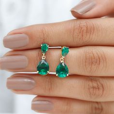 Product Details Get ready to turn heads and receive compliments with these Lab Created Emerald Drop Earrings. The Pear Cut Lab Created Emerald in a Claw Setting adds a touch of glamour to these Classic Teardrop Earrings, making them the perfect jewelry accessory for your loved ones. Product Information SKU SHP-EARRINGS022012188 Length 14.65 mm Width 6.75 mm Height 3.5 mm Weight 1.76 gm (Approximate) LAB CREATED EMERALD INFORMATION No.of Stones 4 Pieces Total Weight 4.30 Carat (Approximate) Dimen Emerald Drop Earrings, Emerald Earrings Drop, Earrings Making, Lab Created Emerald, Claw Setting, Signature Jewelry, Timeless Jewelry, Pear Cut, Conflict Free Diamonds