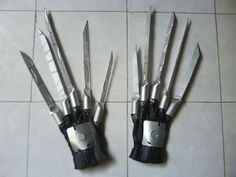 there are several knives in the hands of each other on the tile floor, and one is broken