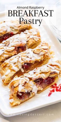 almond raspberry breakfast pastry on a white plate with the words almond raspberry breakfast pastry