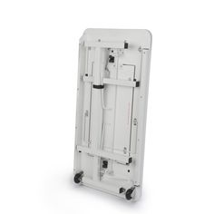 the back side of a white case with wheels and latches on it's sides