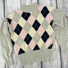 "Cozy up in this beautifully made, knitted vintage Arlando brand pullover sweater. It's made with lambswool and angora so it's super soft, both in look and feel. Diamond pattern in baby pink, black, off-white, and grey, with wide grey ribbed cuffs and waist. Vintage fit with drop shoulders, lightweight shoulder pads (which can be removed), and full / slightly puffy sleeves. Excellent vintage condition. Tag - Size Small Petite.  (Vintage sizes may vary from today's modern sizing, so please refer to measurements to ensure correct fit.) Measurements are taken with garment laid flat. Waist: 14-20\" Length: 23\" Chest: 20\" Shoulder: 7\" Sleeve: 21\" Fiber: 70% Lambswool, 20% angora rabbit hair, 10% nylon Detailing: Grey ribbed cuffs, neck, and waist. Care: dry clean About my vintage items: Bec Magenta Sweater, Kawaii Sweater, Pull Rose, Geometric Sweater, Argyle Sweater, Vintage Fits, Couture Vintage, Yellow Sweater, Puffy Sleeves