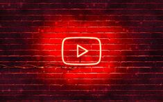 a red brick wall with a neon sign that says youtube on it and an arrow in the middle