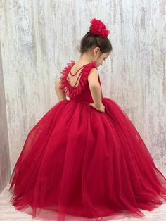 Make your little one's special occasions unforgettable with our stunning Red Baby Girl Dress. Perfect for New Year's celebrations, birthdays, and parties, this handmade dress features exquisite back pearl detailing that adds a touch of elegance and charm. Key Features: Design: Elegant red dress with beautiful back pearl detail, perfect for making a statement at any event. Sizes: Available in various sizes to fit baby girls comfortably. Material: Crafted from high-quality, soft, and breathable fa Red Ball Gown Dress For Dress-up Occasions, Elegant Holiday Tutu Dress For Pageant, Elegant Tutu Dress For Holiday Pageants, Red Princess Dress For Wedding, Red Ball Gown For Dress-up, Red Ball Gown Dresses For Dress-up, Red Ball Gown For Party And Holiday Events, Red Ball Gown For Wedding And Holiday, Princess Red Ball Gown For Holidays