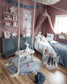 a child's bedroom decorated in pink and blue