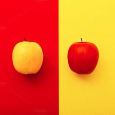 two apples and an apple on a red, yellow and blue background with the same color