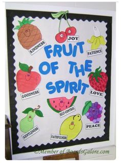 a fruit of the spirit bulletin board with pictures of fruits on it and words written below