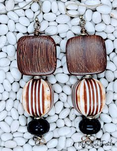 Bulahan Wood in Square Shape suspended from a Vintage Lucite Cube Bead. The Bead is a Washed Finish in Ivory and Brown Etchings.  Etched Wood Bead Embellishment. Antique Brass Ear Wire and can be converted to a Clip On. Adjustable Brown Beaded Earrings With Large Beads, Brown Dangle Beaded Earrings With Large Beads, Brown Round Beaded Earrings For Beach, Brown Round Bead Earrings For The Beach, Brown Beaded Earrings For Beach With Dangling Beads, Brown Beaded Earrings For Beach, Brown Round Beads Earrings For Beach, Brown Beaded Dangling Earrings For Beach, Brown Dangle Earrings With Large Beads