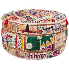 a multicolored patchwork ottoman with tassels