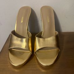 Gold Mules With A Platform Never Worn Gold Casual Heels With Closed Toe, Casual Gold Closed Toe Heels, Casual Gold High Heels, Gold High Heel Mules With 4-inch Heel, Gold Synthetic Closed Toe Heels, Gold Medium Width Slip-on Heels, Gold Almond Toe Sandals Medium Width, Gold Almond-toe Sandals Medium Width, Gold Synthetic Heels With Almond Toe