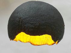 a black and yellow object hanging from the ceiling