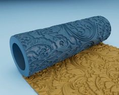 a roll of paper that is sitting on top of a mat with an intricate design